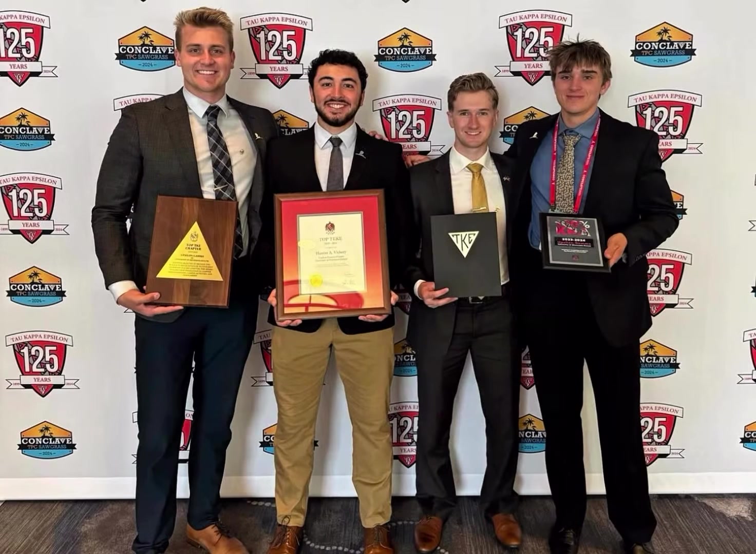Brothers holding Top TKE Chapter awards at TKE's 125th Conclave, 2024