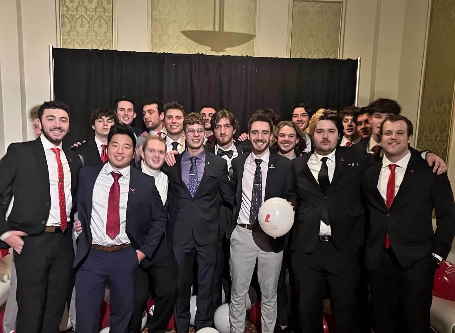 Brothers posing with TKE and St. Jude balloons