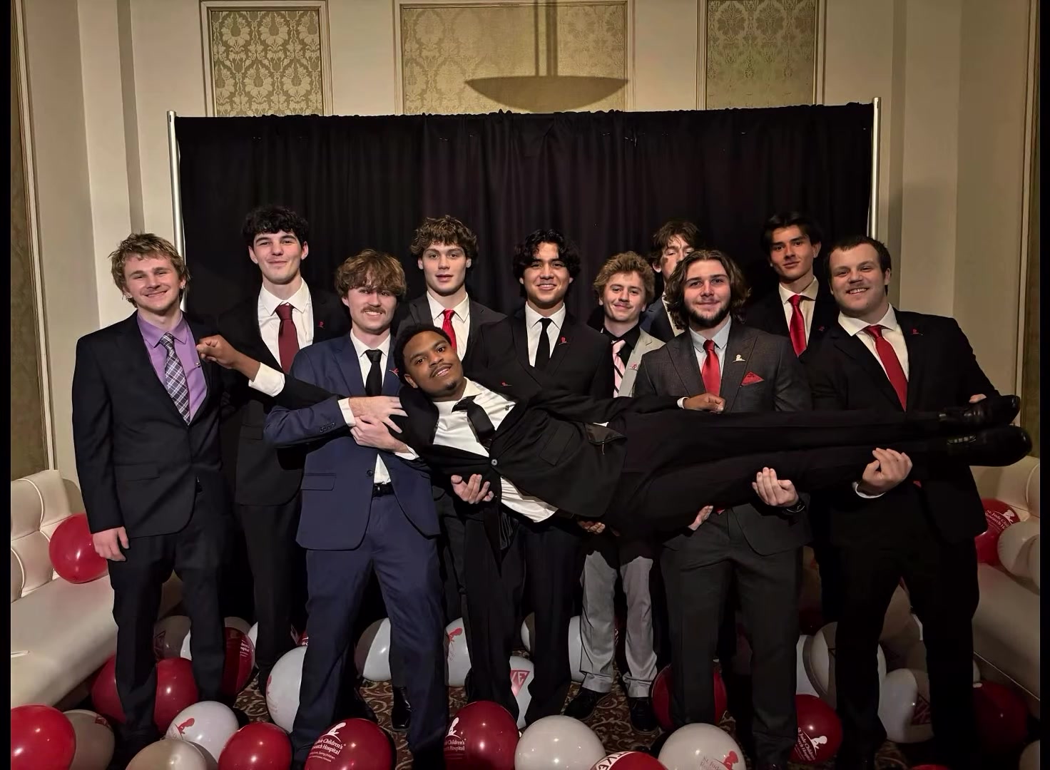 Brothers with St. Jude and TKE balloons
